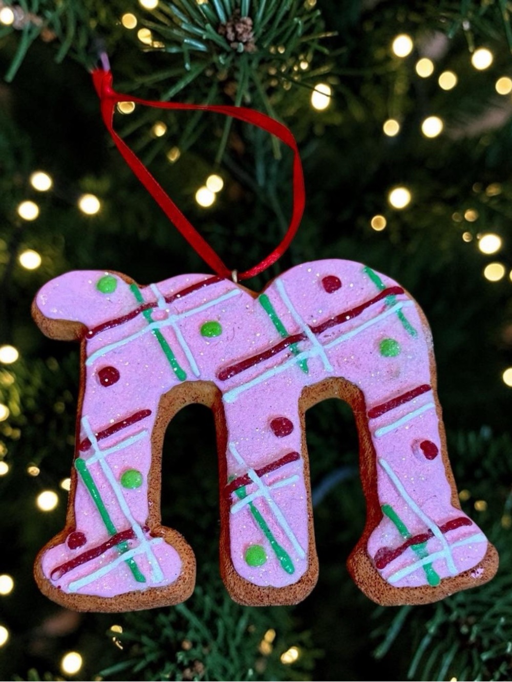 St. Nicholas Square Pink Gingerbread Letter “m” Ornament with Red Ribbon